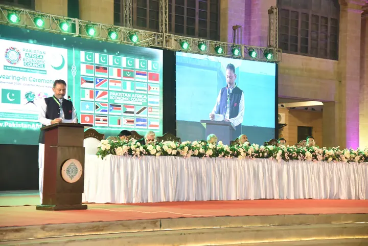 A PAC representative addressing members and guests from the main stage.